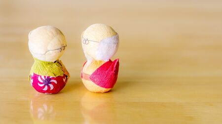 old couple japanese on wood background.の写真素材