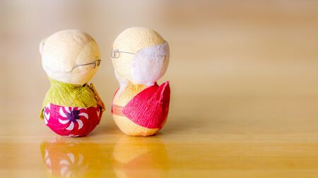 old couple japanese on wood background.の写真素材