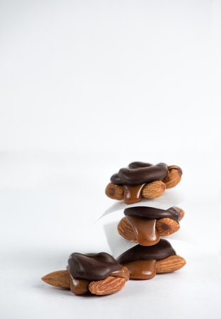 Sweet chocolate turtles with almonds and salted caramel.の写真素材