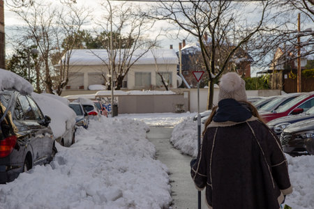 Woman walking in the snowのeditorial素材