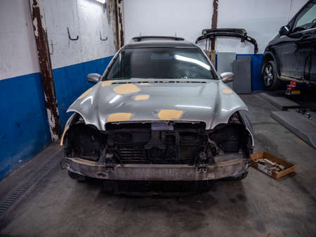 Car to be repaired in a workshopの写真素材