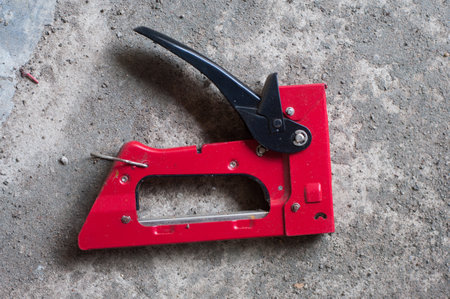 Stapler gun is a furniture upholstery, profession, carpentry tool