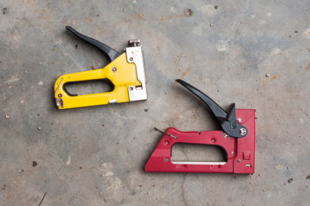 Red and yellow stapler gun