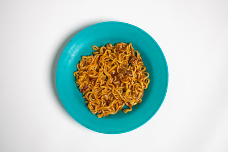 Indomie fried noodles on white background isolated.の写真素材