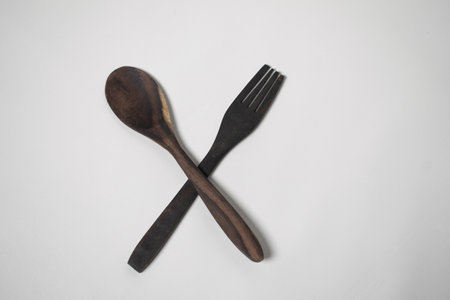 Minimalist wooden forks and spoons, perfect for sustainable dining.の写真素材