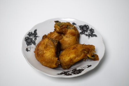 Delicious fried chicken dish on white backgroundの写真素材