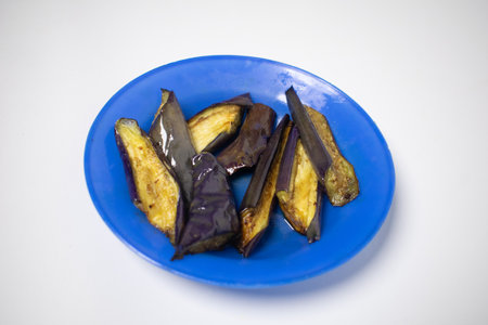 A plate of stir-fried eggplant is ready to be enjoyed as a friendly dish.の写真素材