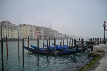 Gondolas on Grand Canal in Venice, Italy during a cloudy day.の写真素材
