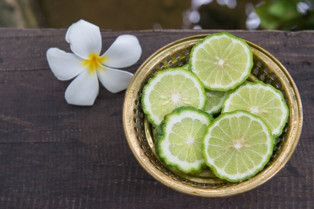 Fresh Green Lime on golden bowl 1の写真素材