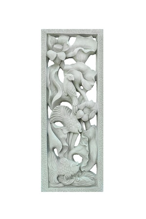 stone carving of fish with white backgroundの写真素材