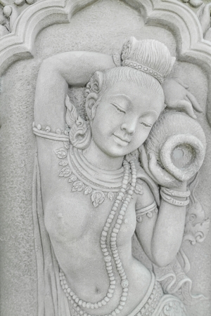 Stone carving of asian womanの写真素材