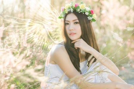 Pretty girl in a spring  flower gardenの写真素材