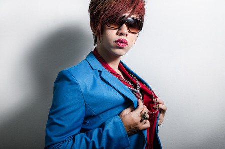 Fashionable man with posing with lipstick tattooの写真素材