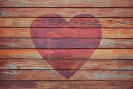 Heart shape on wooden Wallの写真素材