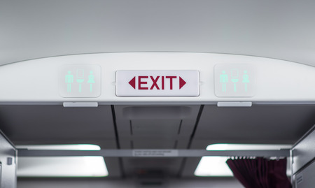 Exit and toilet sign on planeの写真素材