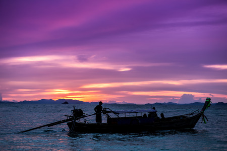 Traditional thai boats at sunset beach.の写真素材