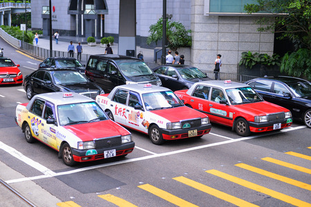 HONG KONG - JUNE 08: Taxis on the street on JUNE 08, 2015 in Hong Kong. Over 90% daily travelers use...