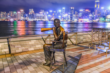 HONG KONG, CHINA - JUNE 09: Statue and skyline in Avenue of Stars on JUNE 09, 2015 in Hong Kong, China. The promenade honours celebrities of the Hong Kong film industry as the famous attraction.のeditorial素材