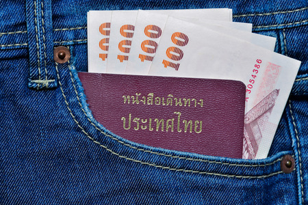Thailand Passport and money in Jean's pocketの写真素材