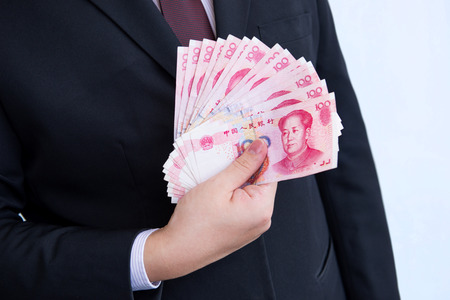Holding Yuan or RMB, Chinese Currencyの写真素材