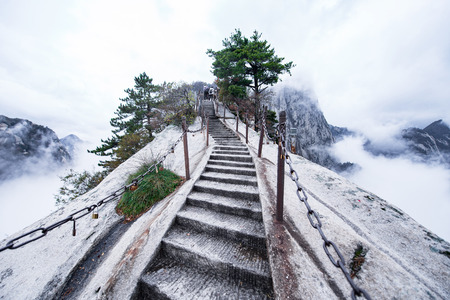 Huashan mountain. The highest of Chinaâs five sacred mountains, called the "West Mountain",well known for steep trails, breath-taking cliffs, narrow passages, and grand sceneryの写真素材