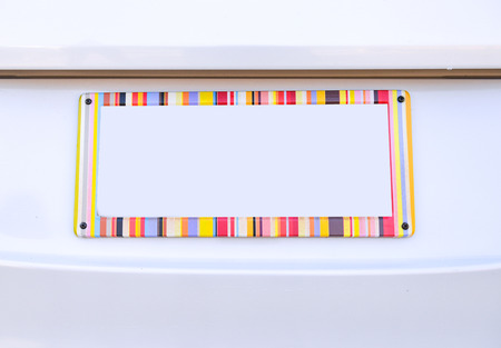 number plate of car with rainbow color frameの写真素材