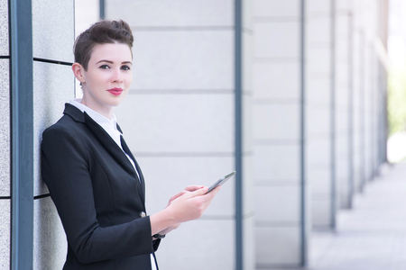 Modern business woman holding tabletの写真素材