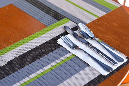 a set of cutlery arranged on tableの写真素材