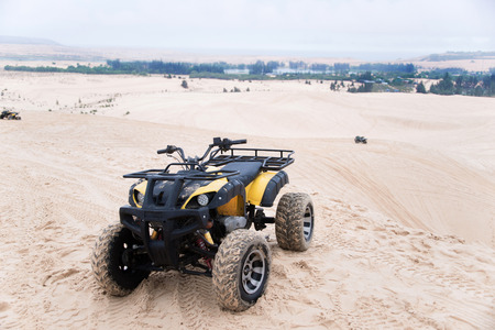 ATV car with white sands. Vietnam desert,Popular tourist attractions in South of Vietnam.