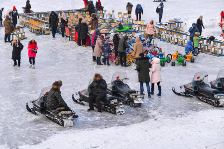 HARBIN, CHINA - JAN 18, 2017: People walking on the frozen Songhua River and There are many activities. January 18, 2017 in Harbin City, Heilongjiang, China.のeditorial素材