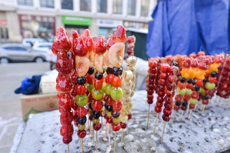 Crispy Sugar-Coated Fruit on a Stick or Fruit candyの写真素材