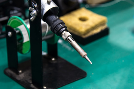 soldering iron and tin string at work stationの写真素材