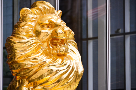 Gold Lion statue in front of buildingのeditorial素材