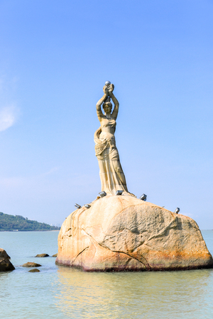 Zhuhai, Guangdong, China -APR 16, 2017: The Zhuhai Fisher Girl Statue is the landmark of Zhuhai city, located at the coast of Xianglu Bay on APRIL 16, 2017のeditorial素材