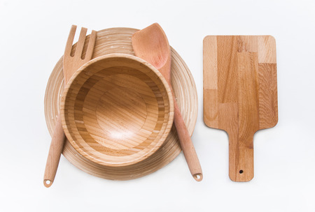 Handmade wooden, vintage kitchen utensils on white tableの写真素材