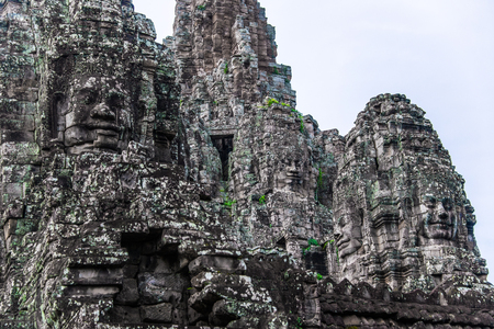 Prasat Bayon with smiling stone faces is the central temple of Angkor Thom Complex, Siem Reap, Cambodia. Ancient Khmer architecture and famous Cambodian landmark, World Heritage.のeditorial素材