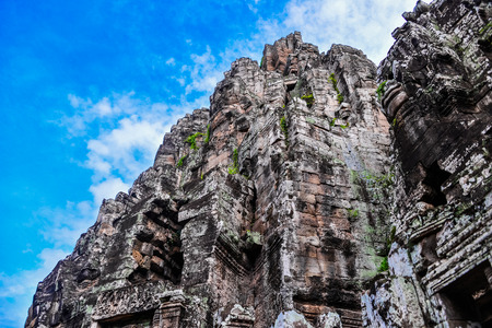 Prasat Bayon with smiling stone faces is the central temple of Angkor Thom Complex, Siem Reap, Cambodia. Ancient Khmer architecture and famous Cambodian landmark, World Heritage.のeditorial素材