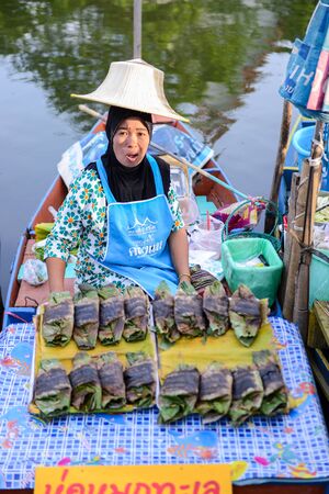 SONGKHLA, THAILAND - April 15, 2018: Sellers sell food and souvenirs at Klonghae Floating Market in Hat Yai, Thailand. The First floating Market in the South of Thailand.のeditorial素材
