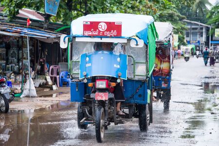 MANDALAY, MYANMAR - JUL 20, 2018: Local Three wheels car in myanmar. The authentical culture of society.のeditorial素材