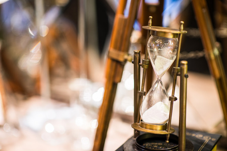 Hourglass is passing down, time conceptの写真素材