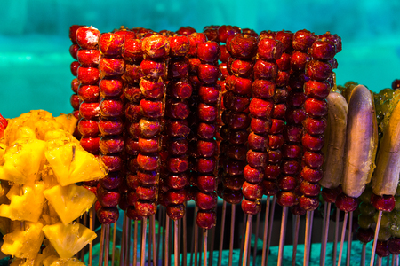 Tang hulu or Chinese sugar-coated fruit stick. The snack of China in the Winter.の写真素材