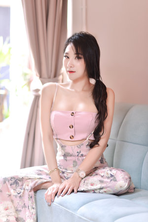 The pretty asian girl is in happy action indoorの写真素材