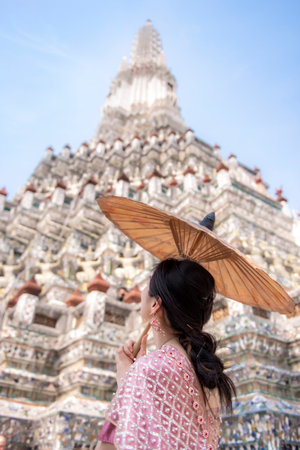 Beautiful Asian girl in Thai traditional costume at templeの写真素材