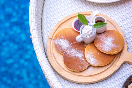 Breakfast in swimming pool, floating breakfast in villa resort. relaxing in calm pool water, healthy...