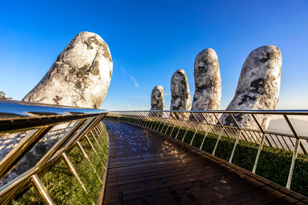 Golden bridge at the top of the Ba Na Hills, Danang city, the famous tourist attraction in central vietnam.の写真素材