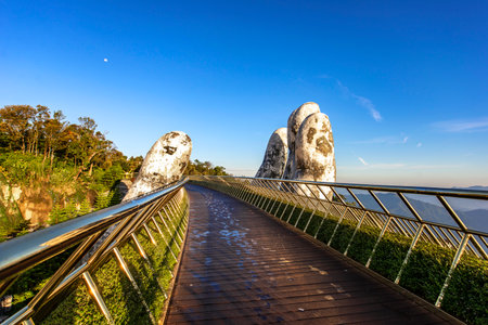 Golden bridge at the top of the Ba Na Hills, Danang city, the famous tourist attraction in central vietnam.の写真素材