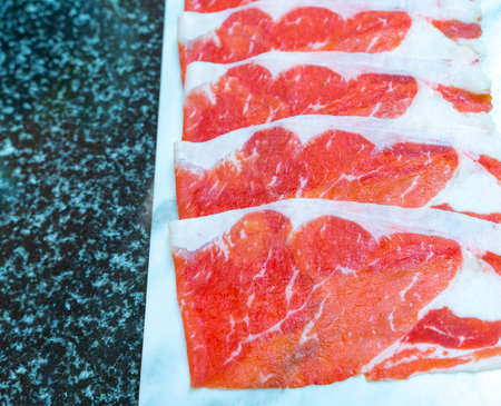 fresh raw sliced beef served for Hot potの写真素材