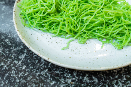 Fresh green noodle on dishの写真素材