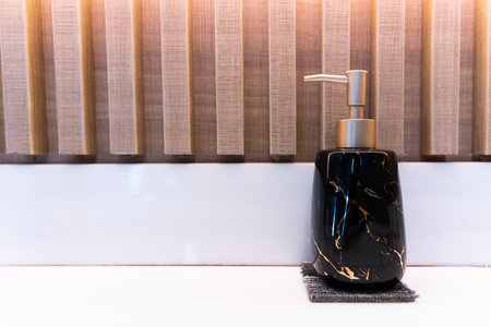 Soap dispensers on table in toiletの写真素材