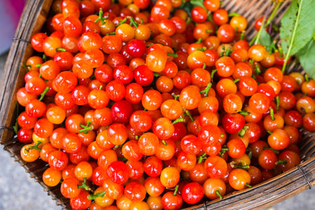 Chinese cherry on the wooden bowl